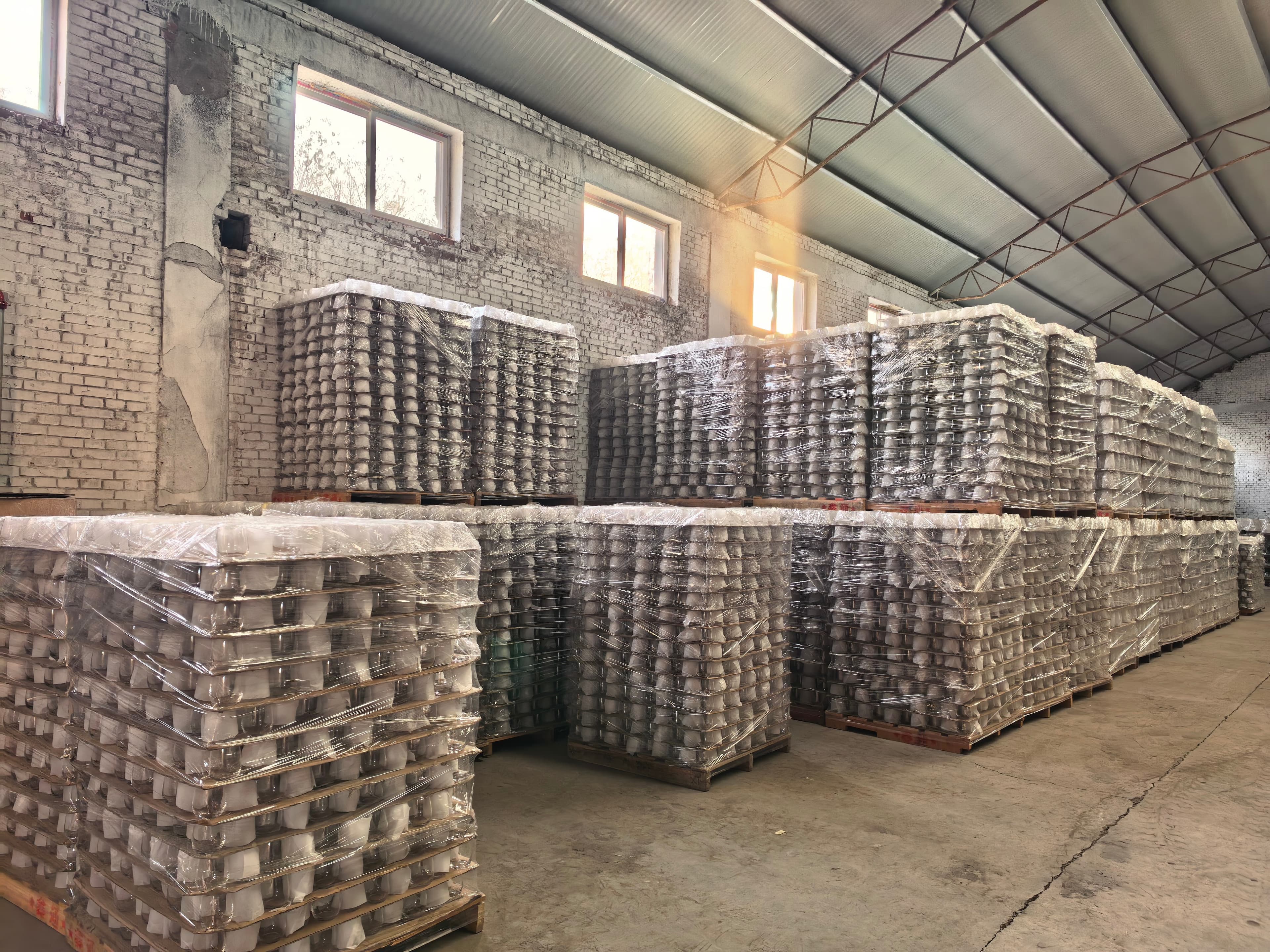 Warehouse with pallets of glass products