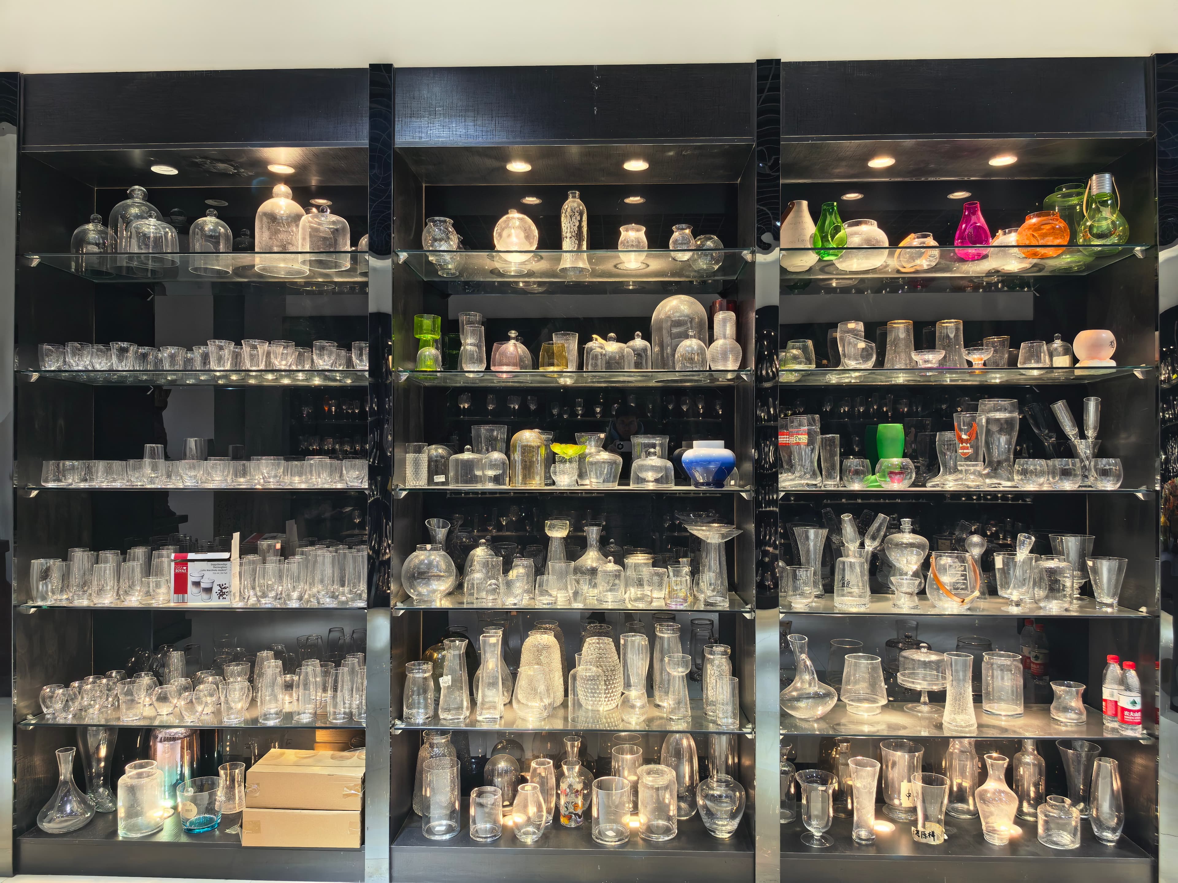 Glass domes, colored glass pieces, and decorative glassware