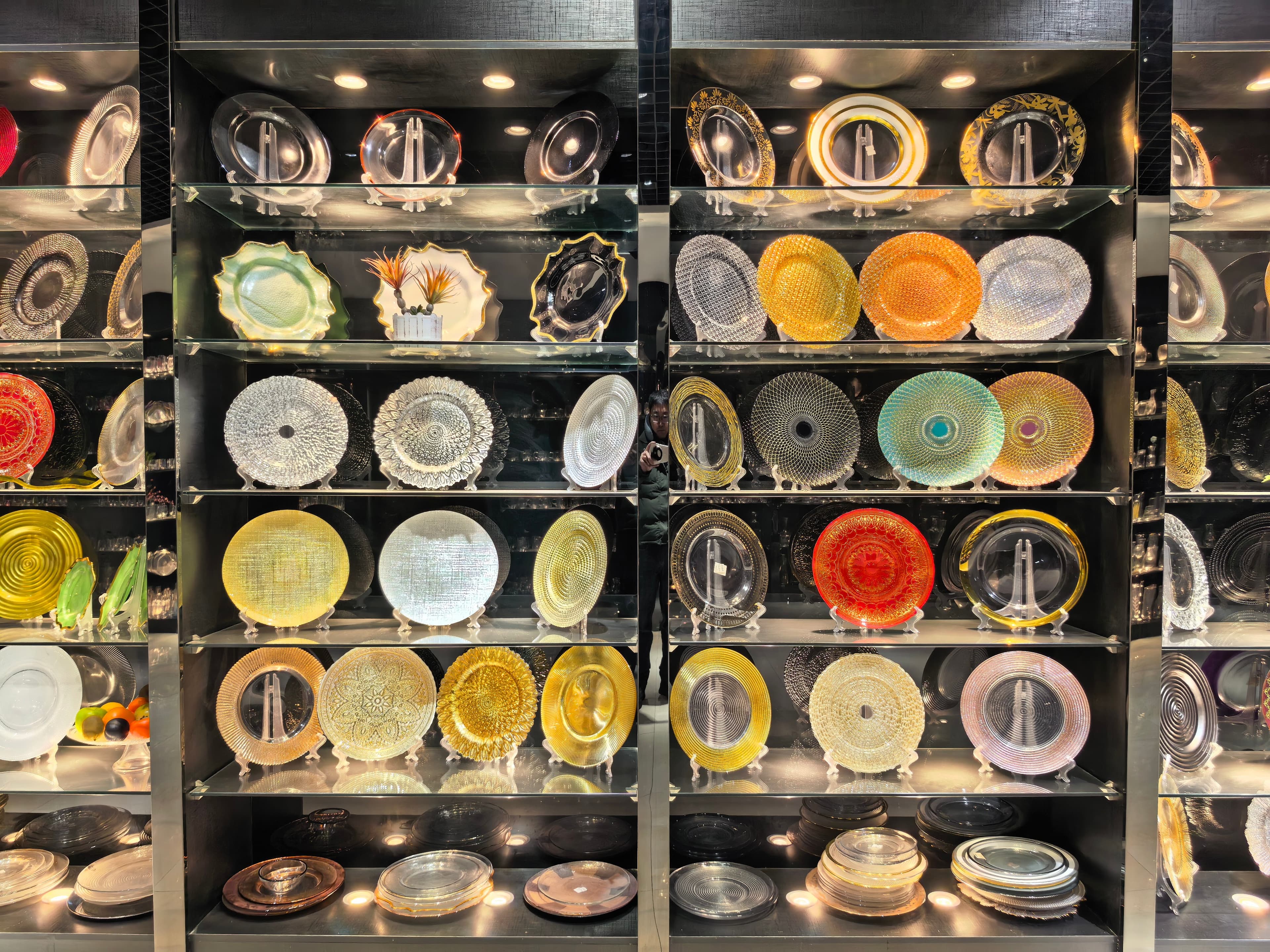 Ornate glass charger plates with gold, silver, and colorful finishes